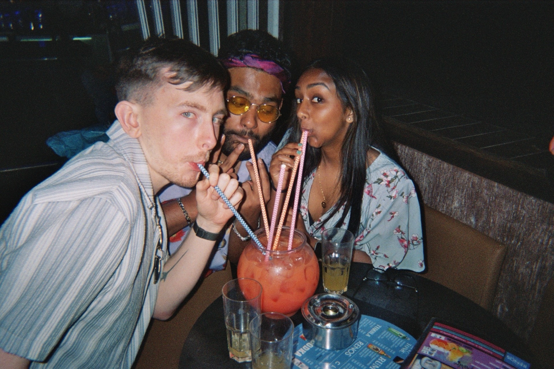 Friends sharing drinks at a bar